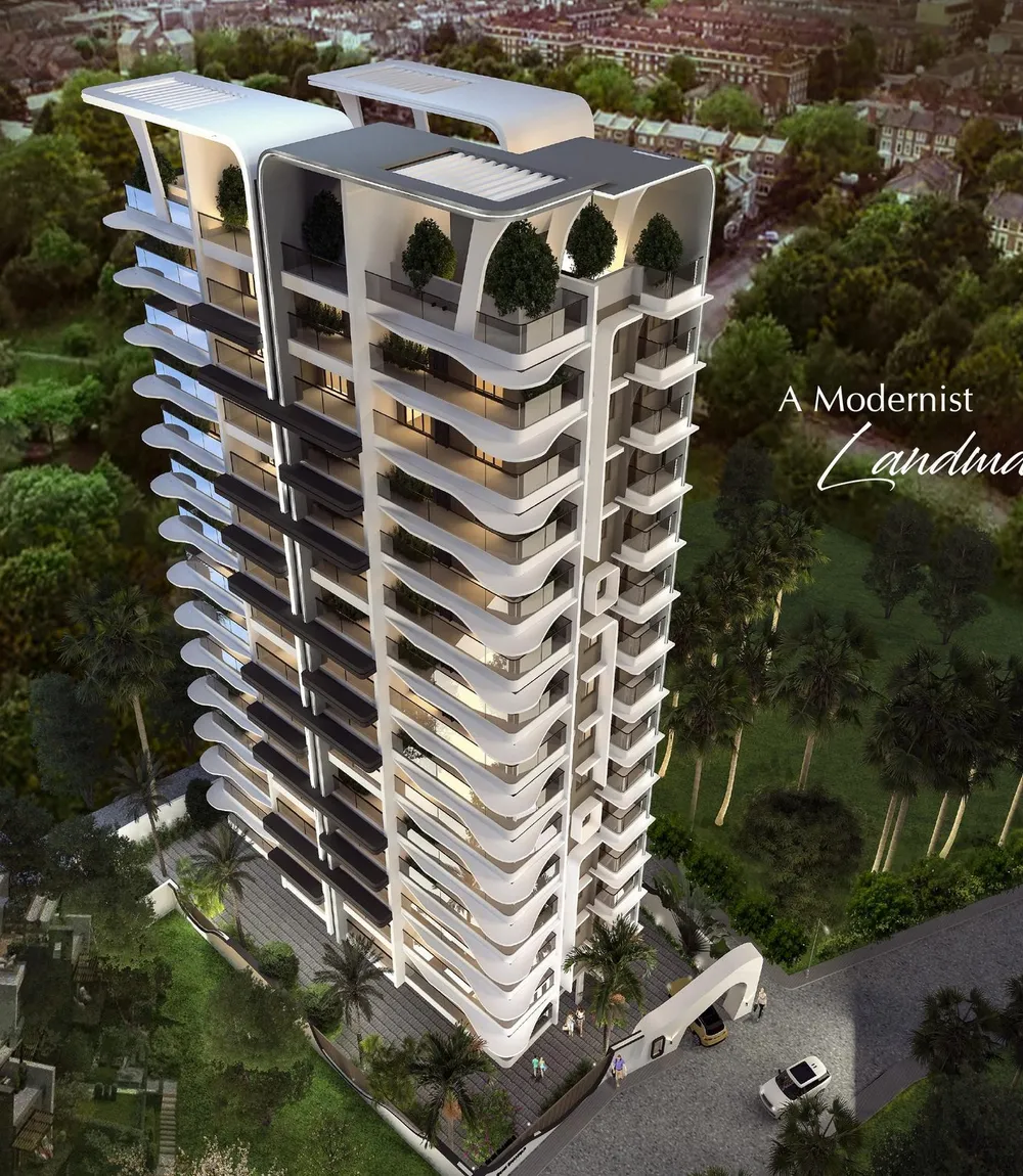Aerial view of a Pranava-built residential tower amid Mangaluru's greenery
